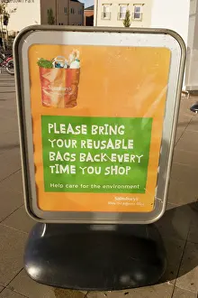 Poster: Poster encouraging reusable bags outside Sainsbury's