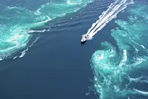 Nordland: Powerboat between huge whirlpools and eddies in