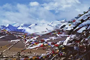 Tibet: Prayer flags, the Himalayas in the distance