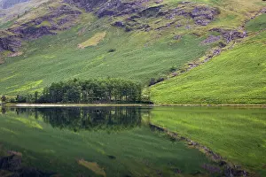 Features: Pre-dawn reflections on Buttermere Lake, Cumbria