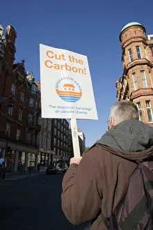 Protest: Protester walking with Operation Noah Cut the Carbon