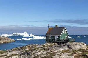 Home: Qeqertarsuaq, Greenland, July 05, 2018: A green w