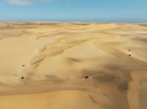 Dune: Quad bikes in the dunes of the Namib Desert in the vicinity of the coastal town of Swakopmund