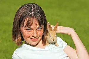 Stroking: Rabbit - being held by girl