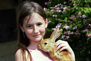Stroking: Rabbit - being held by girl
