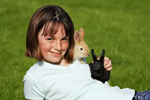 Stroking: Rabbits - being held by girl