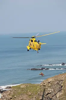 Rescues: RAF helicopter air sea rescue - hovering over rocks
