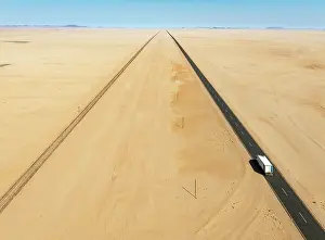 Lorry: Rails and the B4 tarred road between Aus and Lüderitz in the southern Namib Desert