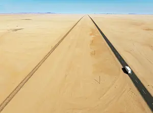 Lorry: Rails and the B4 tarred road between Aus and Lüderitz in the southern Namib Desert