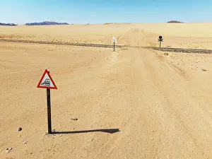 Track: Rails and level crossing in the southern Namib Desert
