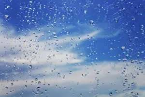 Plane: Rain drops on airplane window after storm