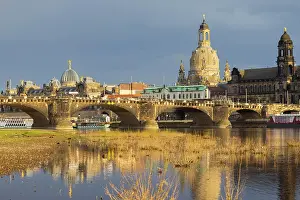 Church: After a rain shower, Dresden's silhouette is illuminated b