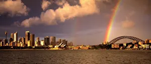 Sydney: Rainbow and city skyline with Opera House and Bridge
