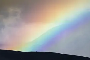 Prismatic: Rainbow and clouds, flank of table volcano HerEubreiE