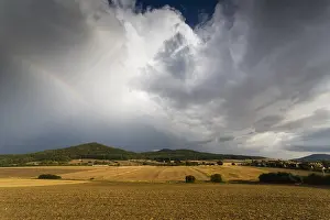 Storms: Rainbow - rest of and arable land after summer storm