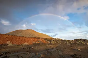 Hierro: Rainbow and typical volcanic landscape at La Restinga