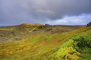 Northeastern: Rainbow over volcanic landscape and colourful autumn