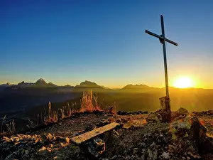 Hochkalter: Rauher Kopf summit cross at sunset, in the background
