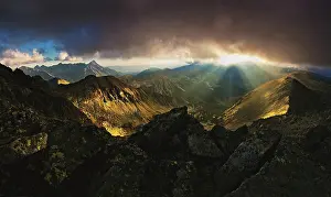 Rays: The rays of the setting sun that break through the
