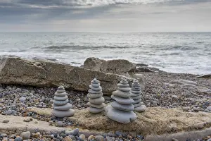 Manche: Realization of cairns on a beach of the Opal Coast