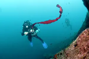 Practicing: Rebreather divers practising with Surface Marker Buoy, Ischi