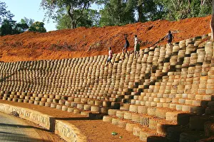 Embankment: Recycling - installing car tyres to stop erosion