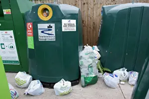 Overflowing: Recycling - overflowing plastic recycling bins