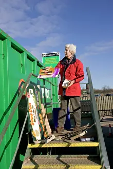 Cardboard: Recycling - Woman recycling cardboard