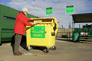 Cardboard: Recycling - Woman recycling Yellow Page directory