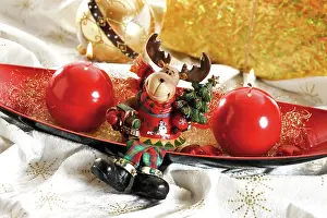 Candle: Red bowl with round candles and moose, reindeer