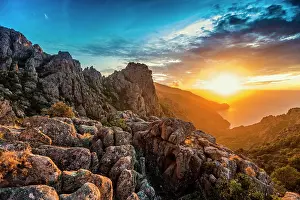 Weathered: Red granite rocks, Tafoni, Calanches de Piana, sunset