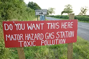 Protest: Red protest sign on roadside against proposed gas