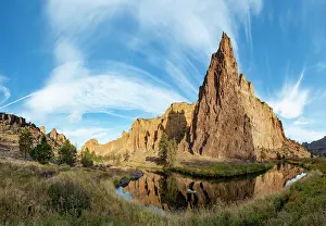 Crooked: Red rock walls in the morning sun, reflected in