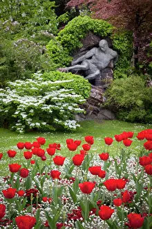 Paris: Red tulips and the L'Effort, a sculpture
