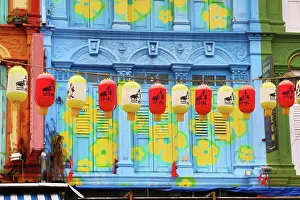 300517: Red and yellow Chinese lanterns hanging in front of colo
