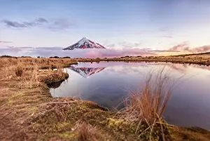 Howse: Reflection in Pouakai Tarn lake, pink clouds around