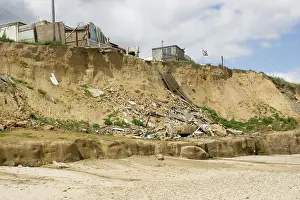 Destructive: Remains of collapsed houses after severe coastal erosion
