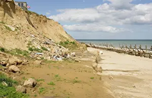 Destructive: Remains of collapsed houses after severe coastal erosion