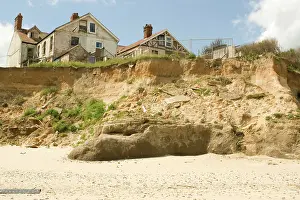 Destructive: Remains of collapsed houses after severe coastal erosion