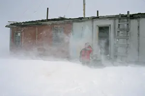 Kara: A researcher outside of a hut of hunters and fishermen