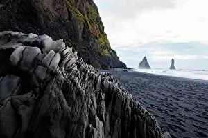 Basalt: Reynisdrangar, Vik, Iceland. Black sand beach in the