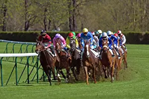 Jockey: Riders and Racehorses galloping around racecourse