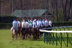 Jockey: Riders and Racehorses galloping around racecourse