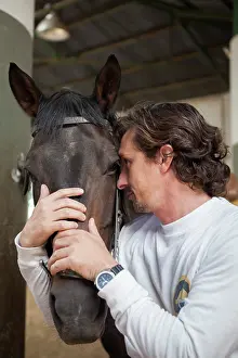 Race: Riding instructor cuddling a horse - Argentina
