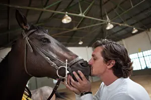 Speaking: Riding instructor kissing a horse - Argentina