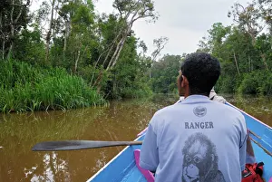 Habtiat: River with boat and guide at Tanjung Puting national park