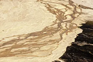 Geothermic: River delta between mountains in vulcanic landscape