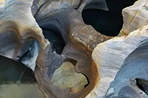 Plunge: River flowing in Bourke's luck potholes