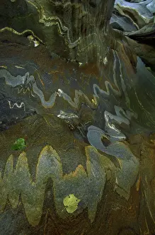 Folded: River rock intrusions