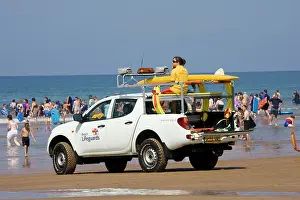Lifeguard: RNLI Beach Lifeguards Rescue vehicle on crowded